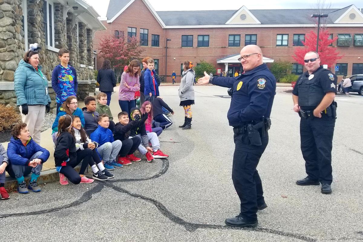 Lt Kurkul and Sgt Young quizzing some GCS students before the Halloween parade 2018