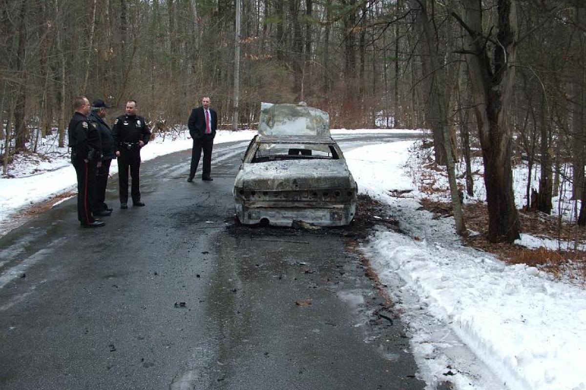 Torched get away vehicle from a Stratham bank Robbery, on scene is Chief Michael Maloney, Officer Wayne Youne and, Former Det. M